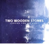 TWO WOODEN STONES